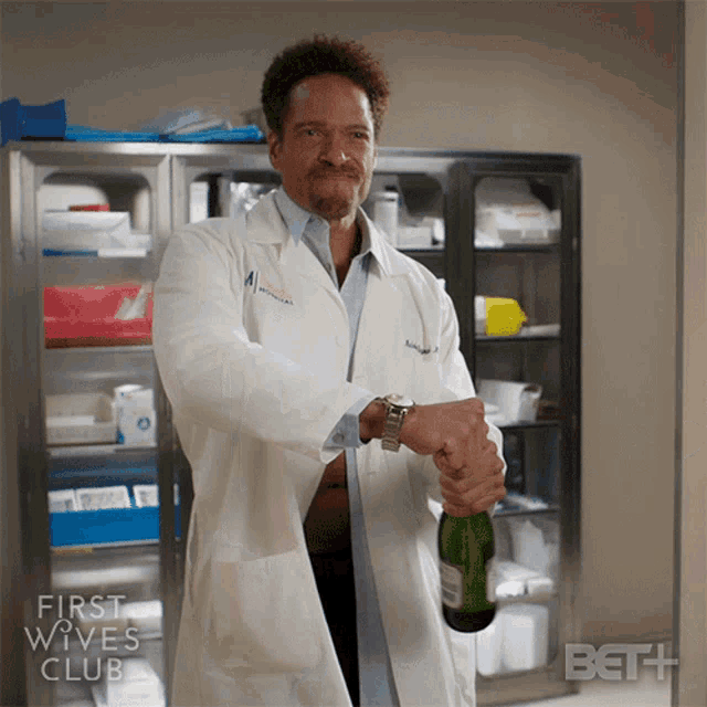 Popping A Champagne Bottle Dr Malcolm Reynard GIF - Popping A Champagne Bottle Dr Malcolm Reynard First Wives Club GIFs
