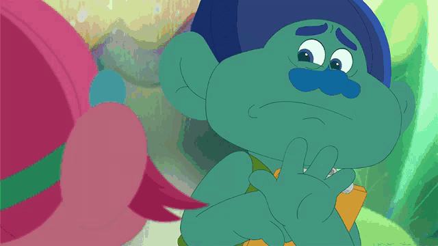 a troll with a blue hat and a blue mustache is making a sad face