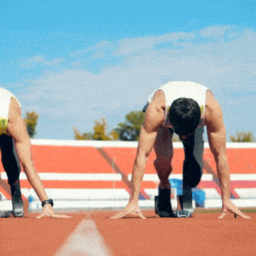 two men are getting ready to run a race on a track