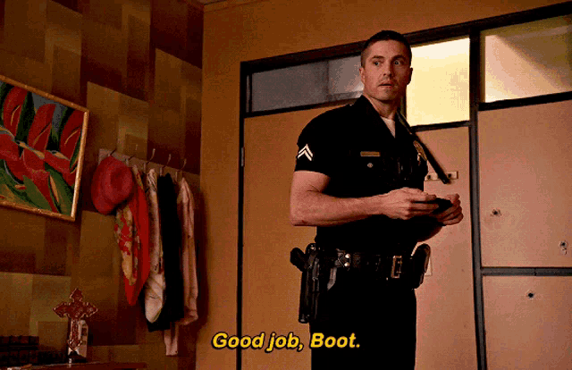 a police officer says good job boot while holding a gun