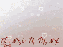 a teddy bear with the words you light up my life on the bottom