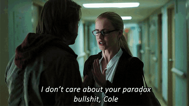 a man and a woman are talking in a hallway and the woman says " i don t care about your paradox bullshit "