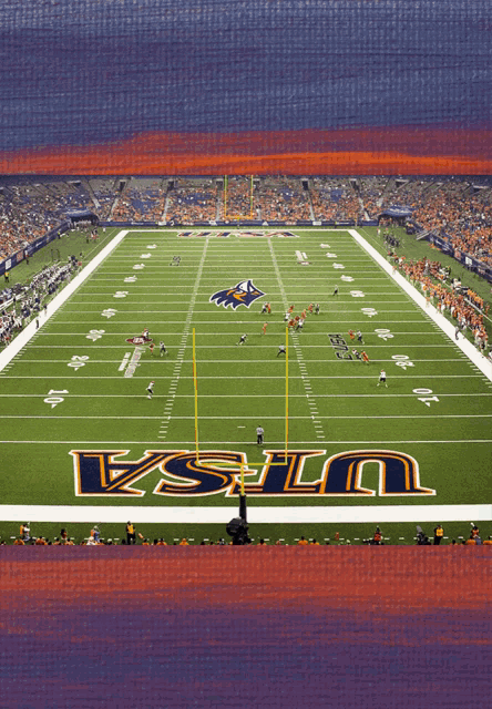 a football field with the word ucla on the field