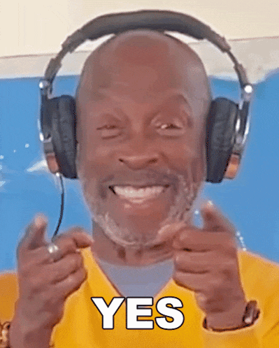 a man wearing headphones is smiling and giving a thumbs up with the word yes below him