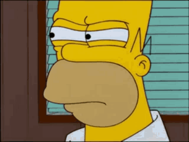 a close up of homer simpson 's face with his eyes closed