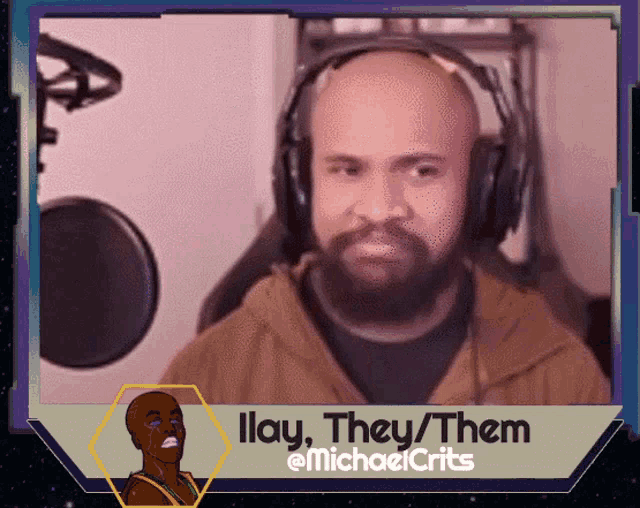 a man with a beard is wearing headphones and they / them is written below him