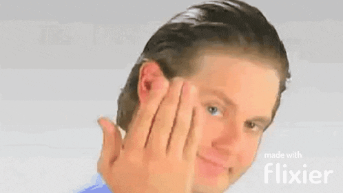 a man is making a funny face with his hands on his face