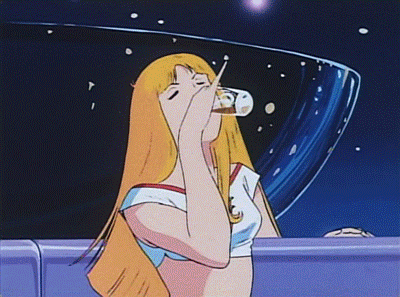a woman with long blonde hair drinking from a glass