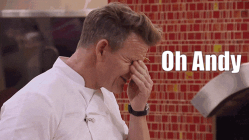 a man is covering his face with his hand and the words oh andy are above him