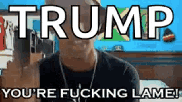 a man is sitting on a bed with the words trump you 're fucking lame on his face .