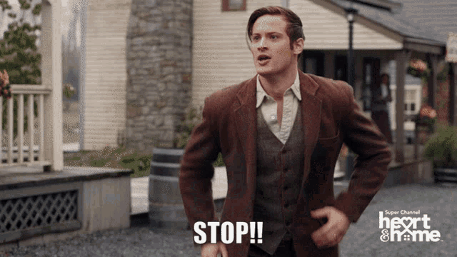 a man in a suit says stop in front of a super channel logo