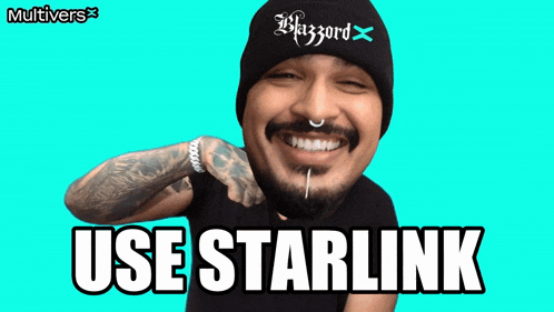 a man wearing a beanie that says blizzard is smiling and says use starlink