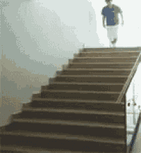 a man is walking up a set of stairs