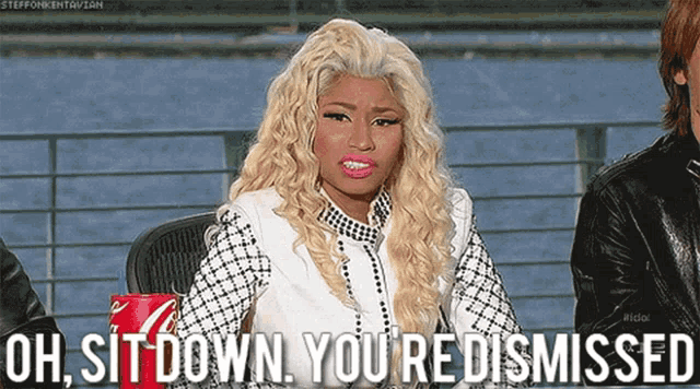 a woman with blonde hair and a coca cola can says oh sit down you re dismissed