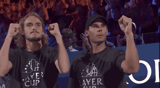 two men wearing black shirts that say laver cup on them