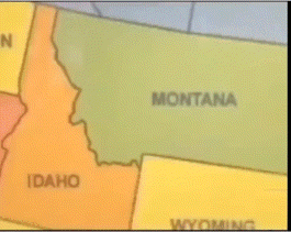 a man stands in front of a map that says idaho and wyoming