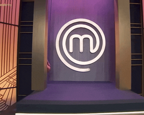 a purple wall with a m in a circle on it