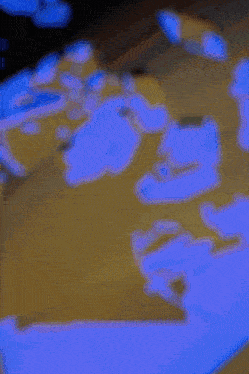 a painting of a blue and yellow circle on a dark background