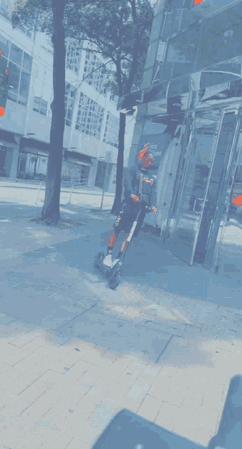 a man is riding a scooter in front of an atm that says chase bank
