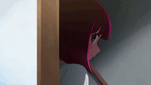 a girl with red hair is peeking out from behind a wall