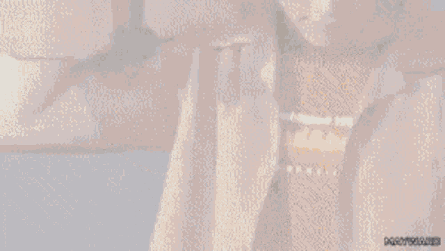 a man in a tan jacket is holding a skateboard