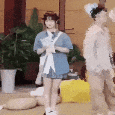 a blurry picture of a woman in a blue shirt
