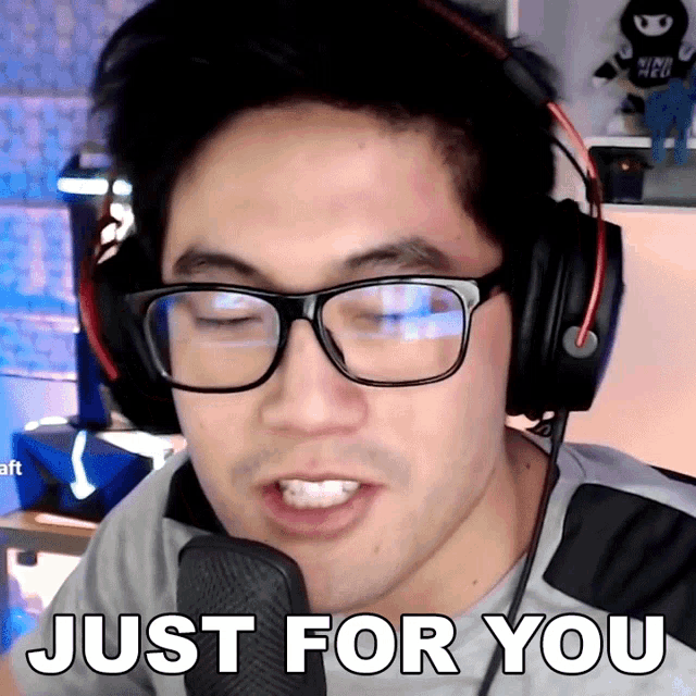 a man wearing headphones and glasses says " just for you "