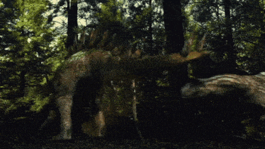 a blurred picture of a dinosaur in the woods