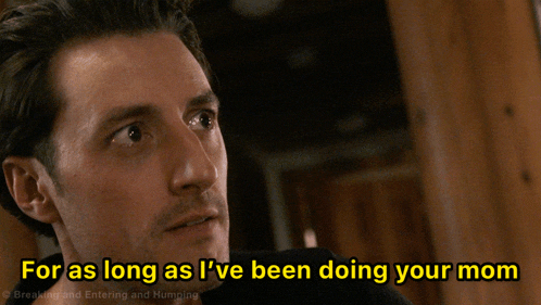 a man with the words for as long as i 've been doing your mom