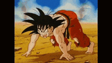 goku from dragon ball z is crawling in the dirt .