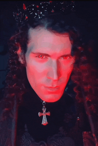 a man with red eyes is wearing a crown and holding a cross