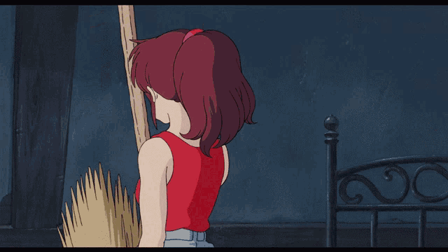 a cartoon girl with a red bow on her head sits on a bed