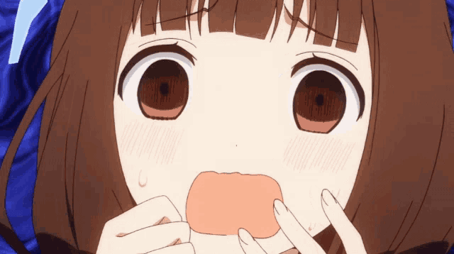 a close up of a girl making a funny face