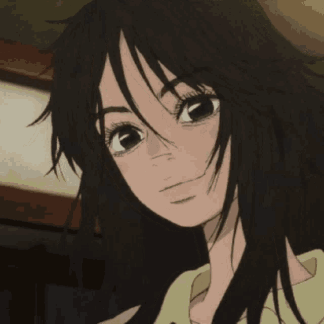 a close up of a girl with long hair and black eyes