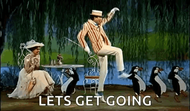 a man is dancing with penguins while a woman sits at a table in a willow tree .