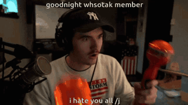 a man wearing headphones and a ny hat says goodnight whsotak member i hate you all j