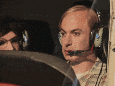 a man wearing headphones looks at something