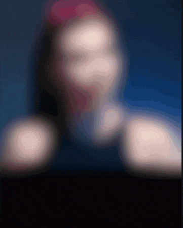 a blurry picture of a person 's face with the number 8 in the background