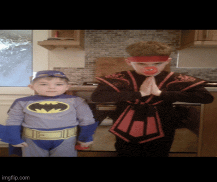a boy dressed as batman and another boy dressed as a samurai