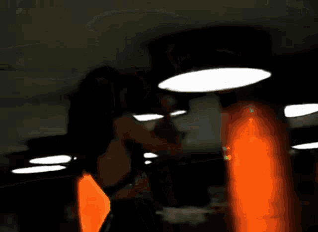 a painting of a person standing in a dark room with orange columns