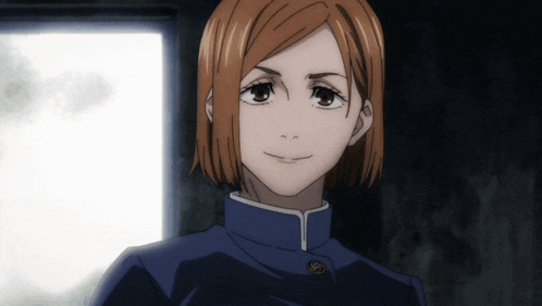 a girl with short brown hair is wearing a blue uniform