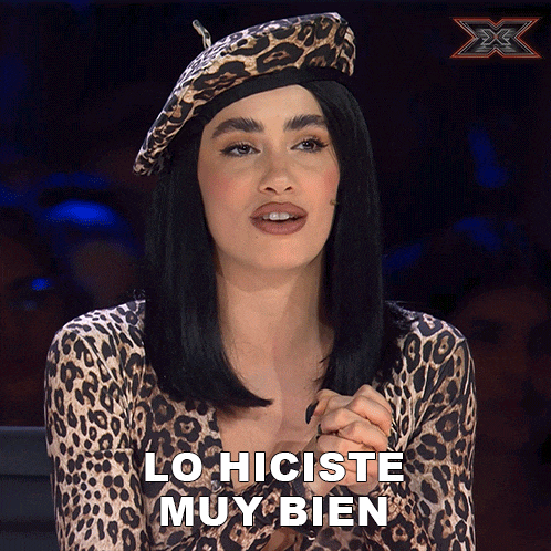 a woman wearing a leopard print top and a beret says " lo hiciste muy bien "