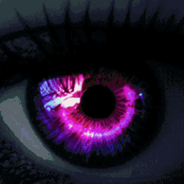 a close up of a person 's eye with a green iris