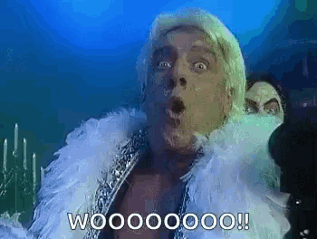 a man with a feather boa around his neck says wooooooo