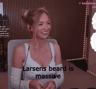 a woman sitting in a chair with the words larsens beard is massive on the bottom