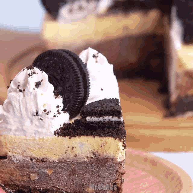 a piece of cake with oreos and whipped cream