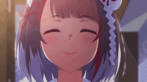 a close up of a girl 's face with a flower in her hair