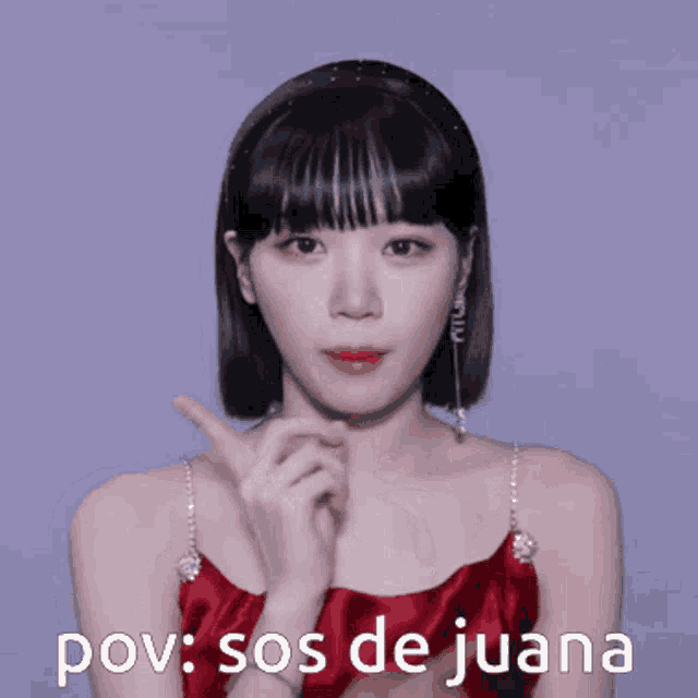 a woman in a red dress with the words pov sos de juana written on the bottom