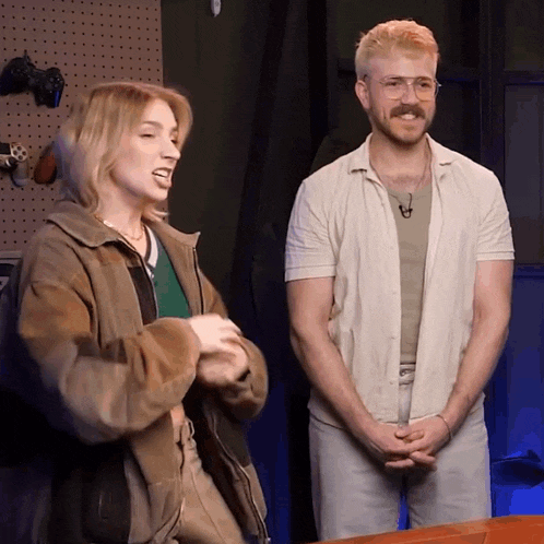 a man and a woman stand next to each other