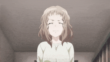a girl with brown hair and a white shirt is making an angry face